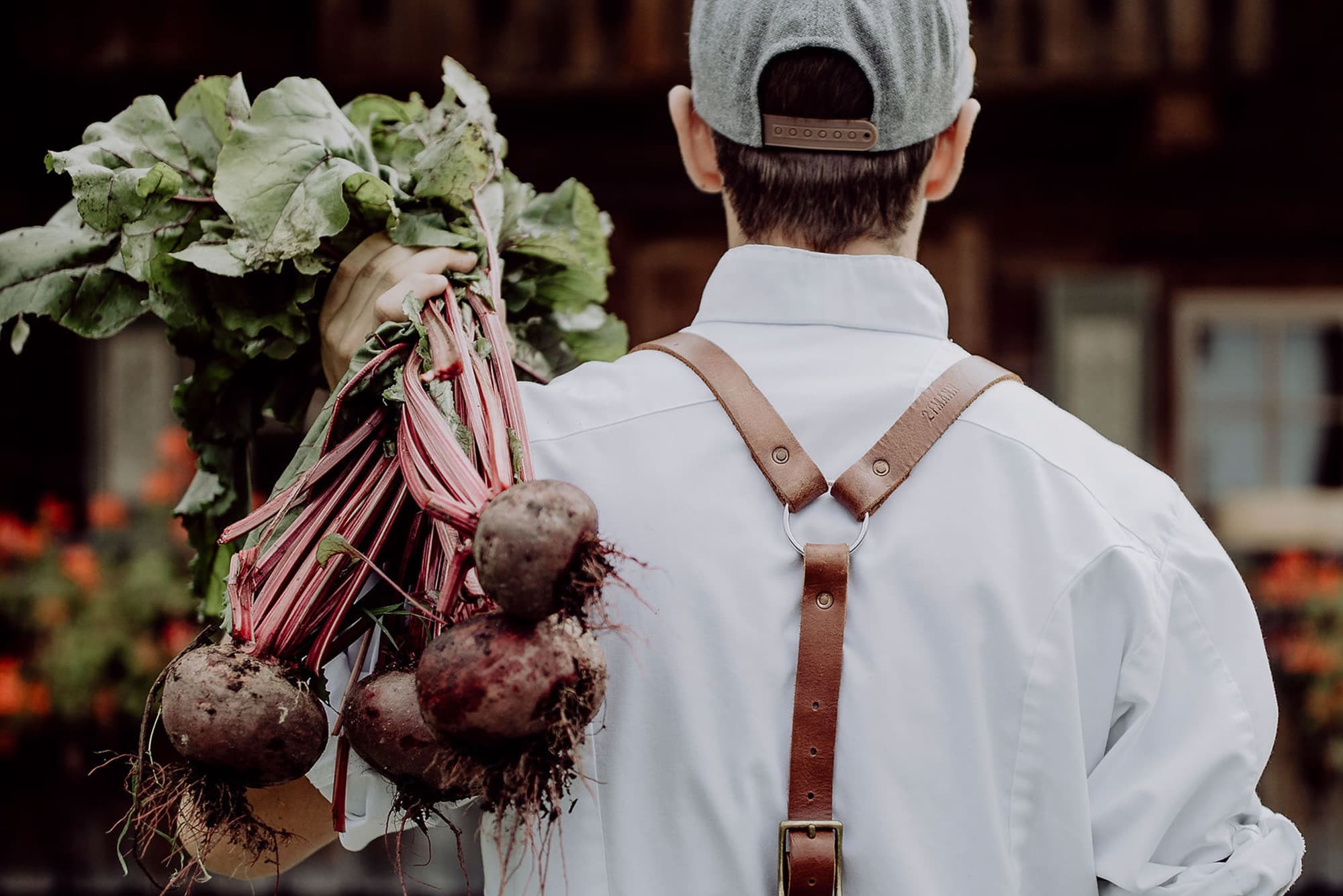 Chef Joseph Oberreiter gets some vegetables from the garden